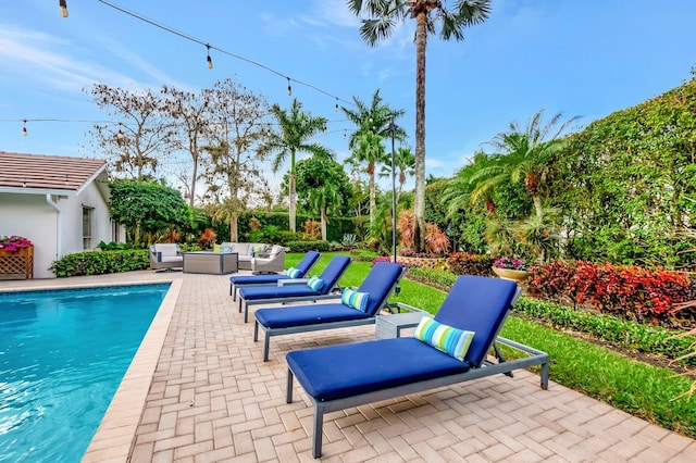 view of swimming pool with an outdoor hangout area and a patio