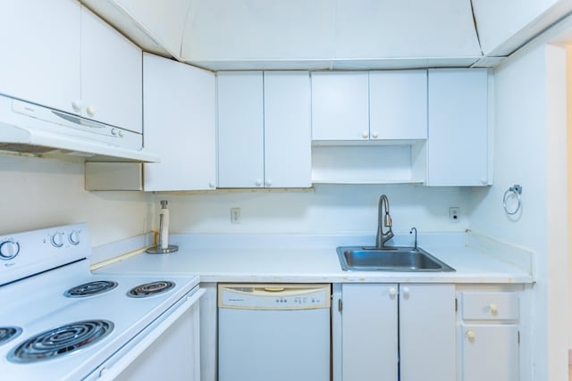 kitchen with sink, white cabinets, and white appliances