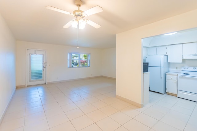 interior space featuring light tile patterned floors and ceiling fan