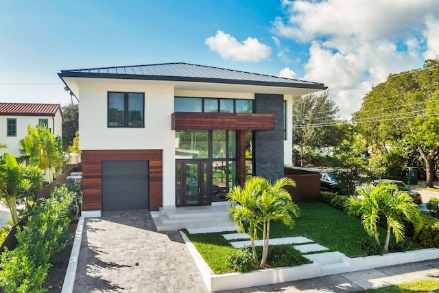 view of front facade with french doors and a garage