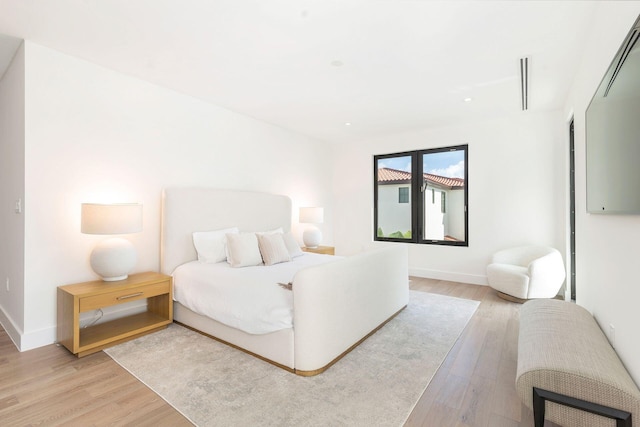 bedroom with light hardwood / wood-style floors