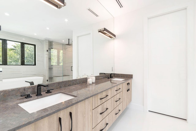 bathroom featuring vanity and plus walk in shower