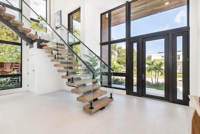 entrance foyer with a wall of windows and a high ceiling