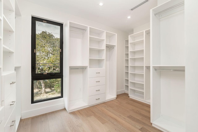 walk in closet featuring light hardwood / wood-style floors