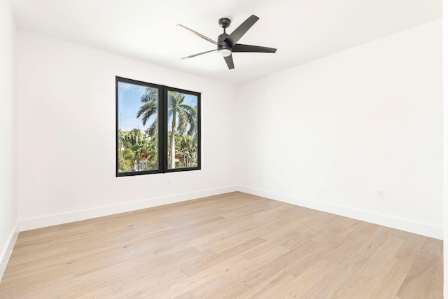 spare room featuring ceiling fan and light wood-type flooring