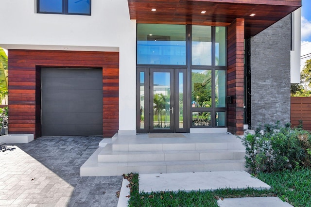 view of exterior entry featuring a garage