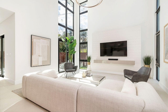 living room with a towering ceiling