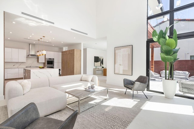 living room with a towering ceiling