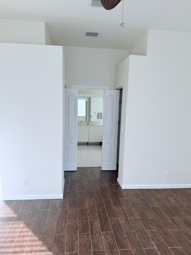 spare room with dark wood-type flooring