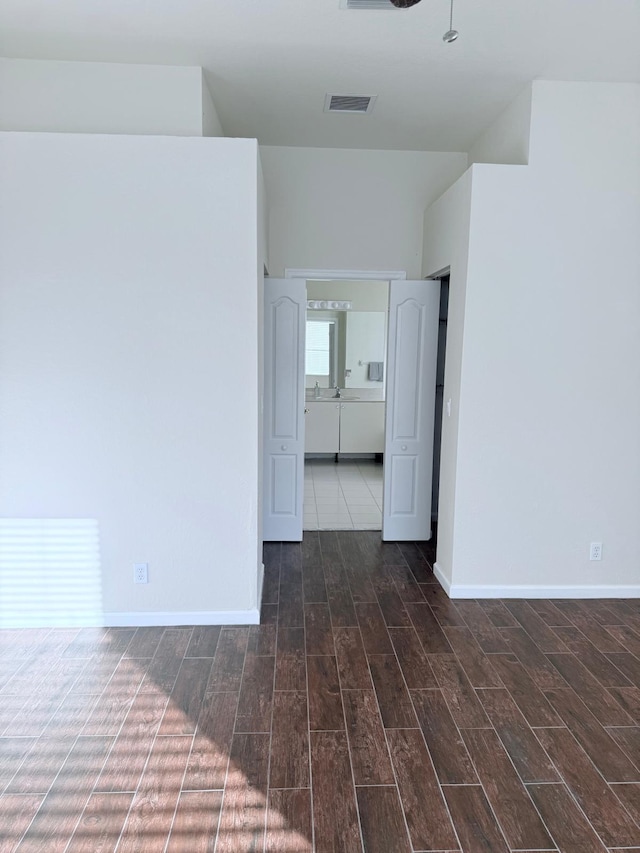 unfurnished room featuring dark hardwood / wood-style flooring