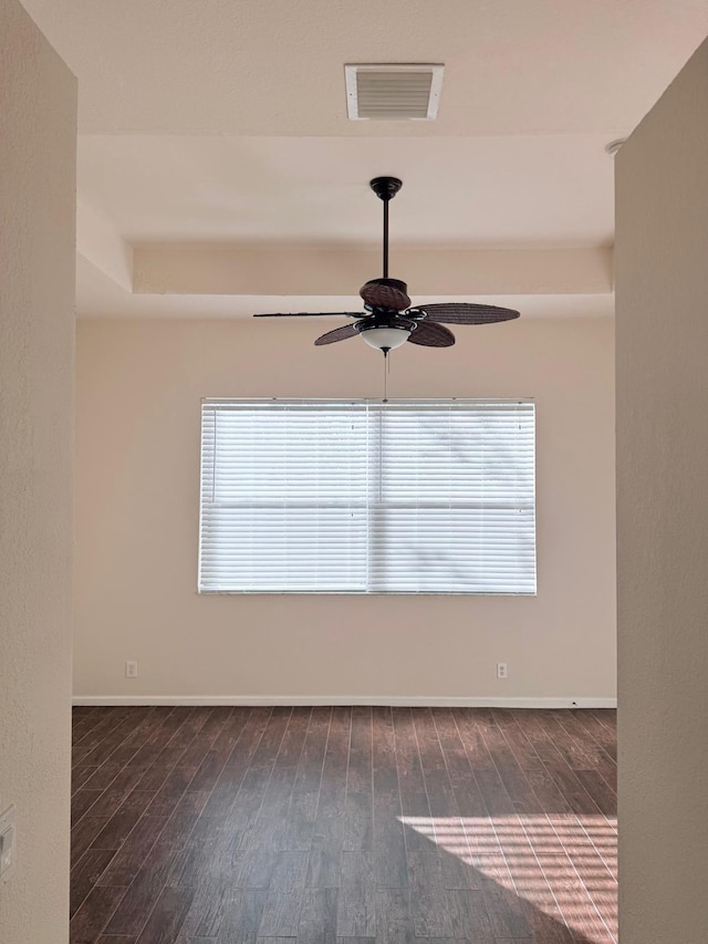 unfurnished room featuring dark hardwood / wood-style floors and ceiling fan