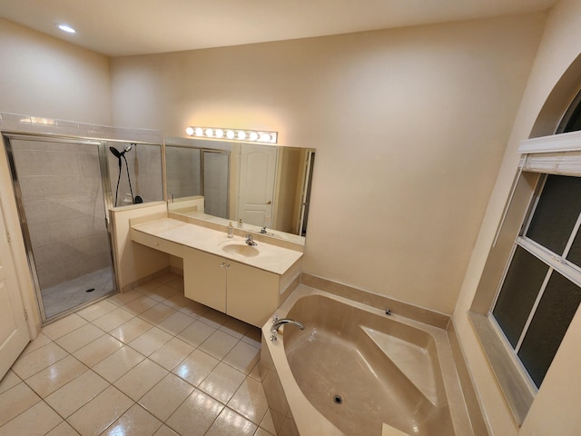 bathroom featuring tile patterned flooring, vanity, and independent shower and bath