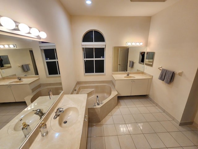 bathroom with vanity, tile patterned flooring, and a bathing tub