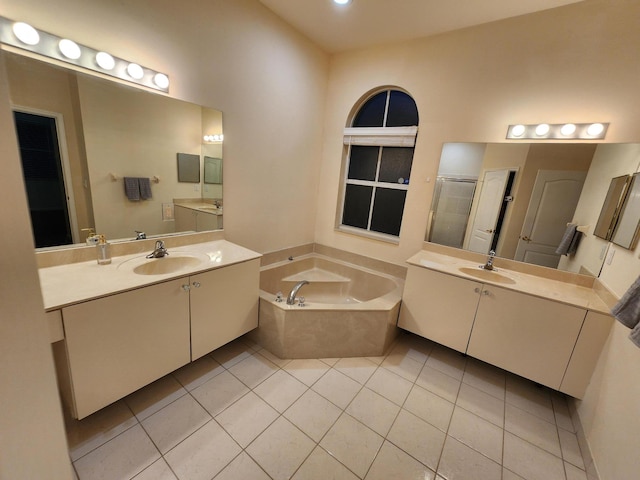 bathroom featuring tile patterned floors, separate shower and tub, and vanity