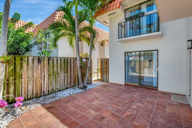 view of patio featuring fence