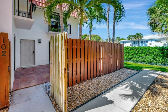 view of gate featuring fence