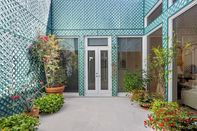 doorway to property featuring a patio area and french doors