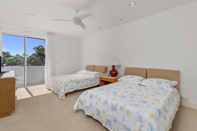 bedroom with access to outside, ceiling fan, and carpet