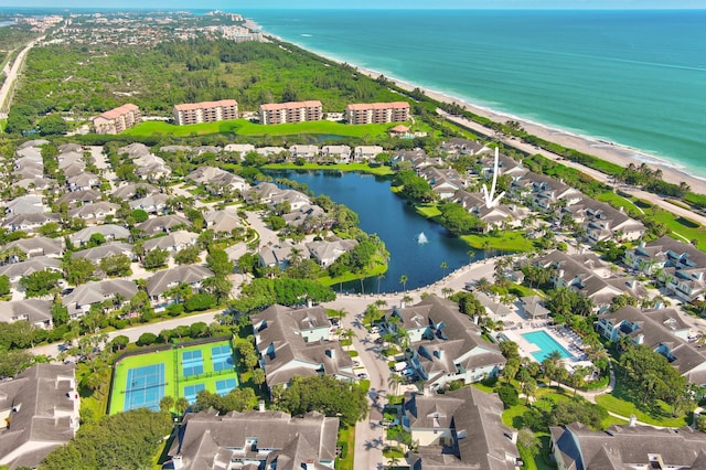 aerial view with a water view and a view of the beach