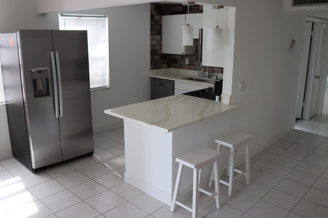 kitchen with white cabinetry, dishwasher, sink, kitchen peninsula, and stainless steel refrigerator with ice dispenser