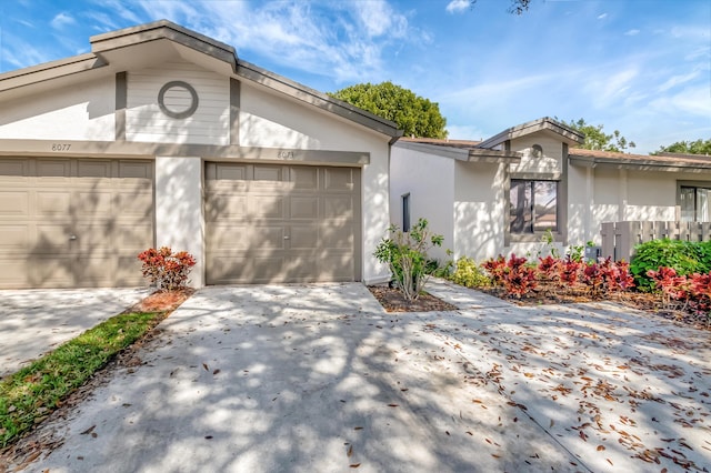 single story home featuring a garage