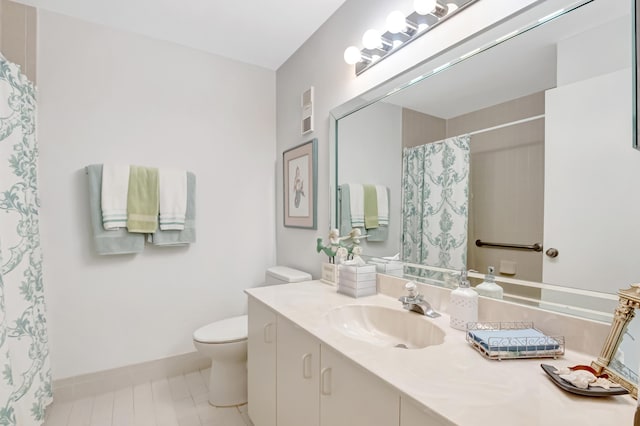 bathroom featuring walk in shower, tile patterned floors, vanity, and toilet