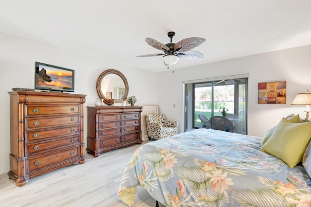 bedroom featuring access to outside, ceiling fan, and light wood-type flooring