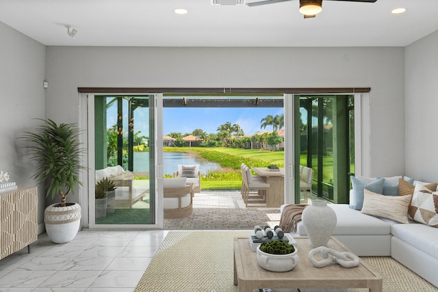 doorway featuring a water view, radiator heating unit, and ceiling fan