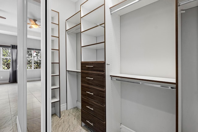 spacious closet featuring ceiling fan