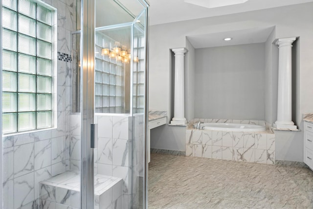 bathroom featuring vanity, independent shower and bath, and ornate columns