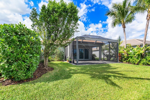 view of yard with a lanai and a patio