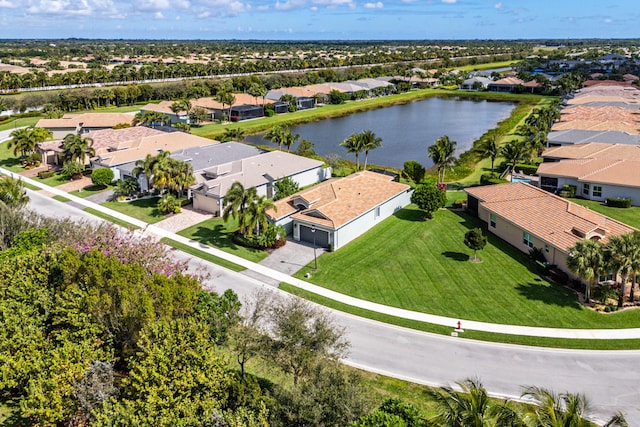 birds eye view of property with a water view