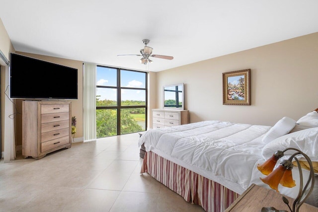 bedroom featuring ceiling fan and light tile patterned floors