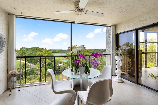 sunroom with a ceiling fan