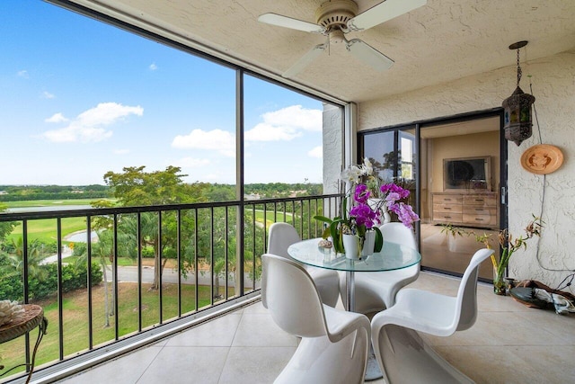 sunroom with a ceiling fan