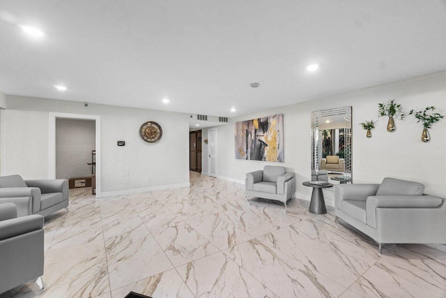 interior space featuring baseboards, marble finish floor, and recessed lighting