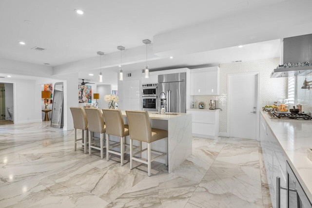 kitchen featuring light countertops, recessed lighting, stainless steel appliances, white cabinetry, and modern cabinets