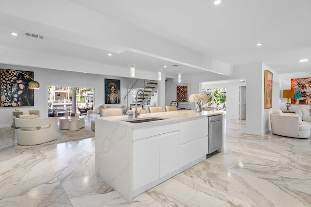 kitchen with visible vents, plenty of natural light, and open floor plan
