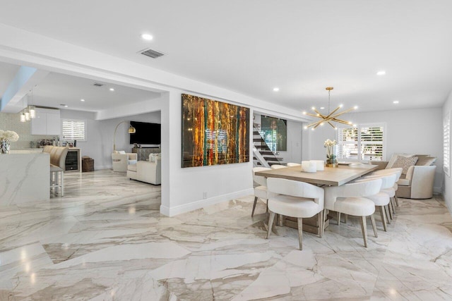 dining room featuring recessed lighting, visible vents, marble finish floor, and a chandelier