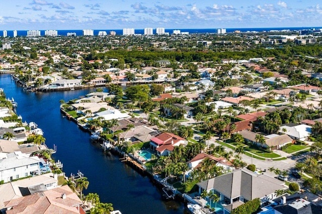 drone / aerial view with a residential view and a water view