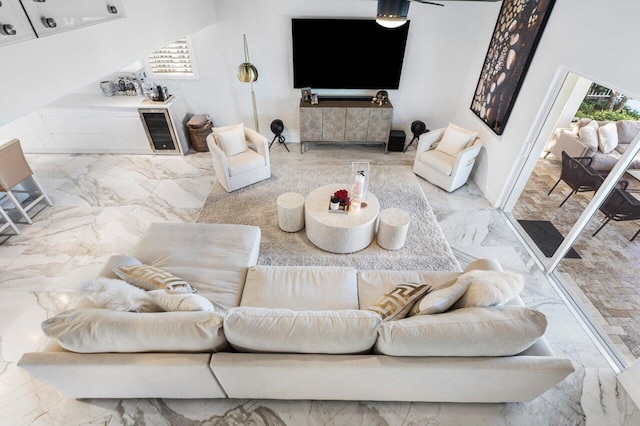 living room with plenty of natural light and marble finish floor