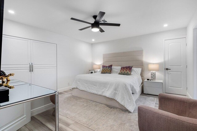 bedroom with light wood finished floors, baseboards, recessed lighting, a closet, and a ceiling fan
