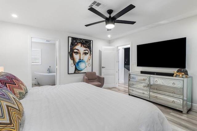 bedroom with visible vents, a ceiling fan, ensuite bath, wood finished floors, and recessed lighting