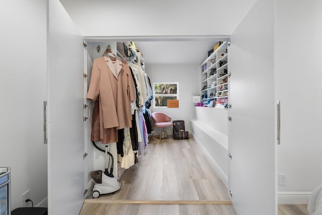 spacious closet with wood finished floors