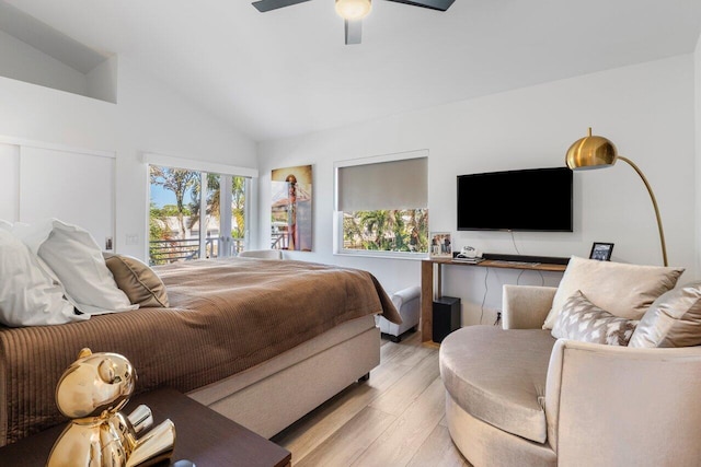 bedroom featuring access to outside, vaulted ceiling, a ceiling fan, and wood finished floors
