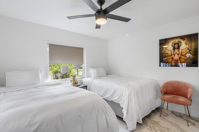 bedroom with marble finish floor, baseboards, and a ceiling fan