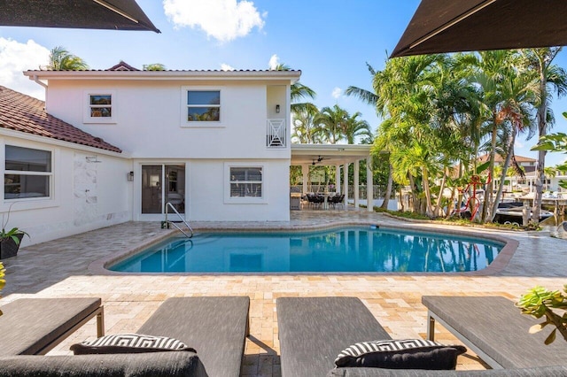 outdoor pool featuring a patio area