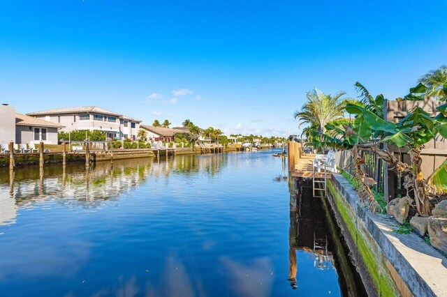 view of dock featuring a residential view and a water view