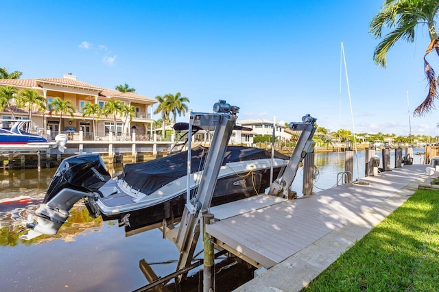view of dock featuring a water view and boat lift
