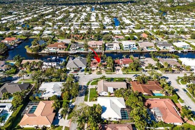 aerial view featuring a residential view and a water view